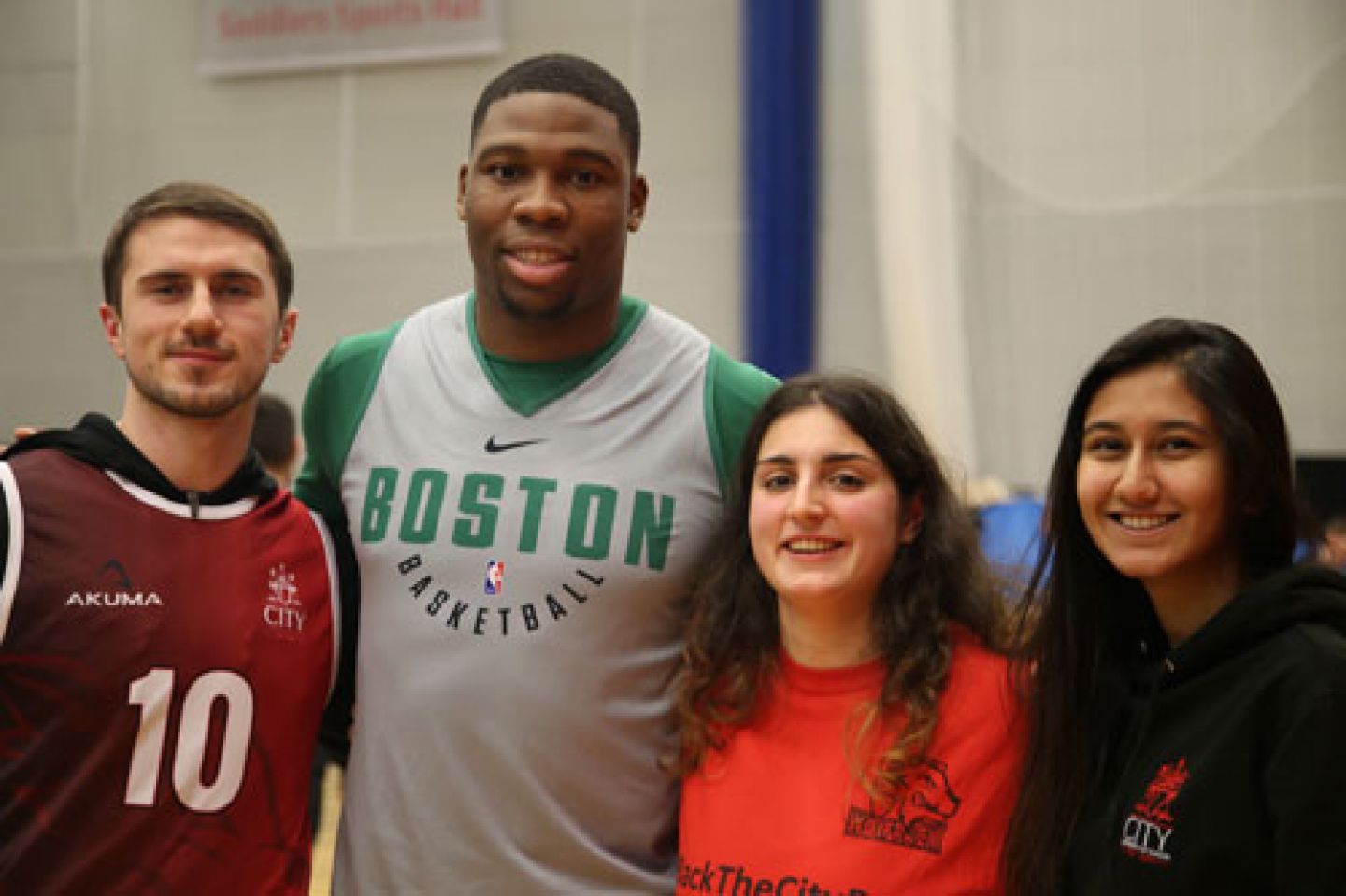 Guerschon Yabusele, power forward for the Boston Celtics, with Vlad Kolesnik, (BSc Finance), Martina Capelli (BSc Business Studies) and Aastha Mehta (LLB Law)