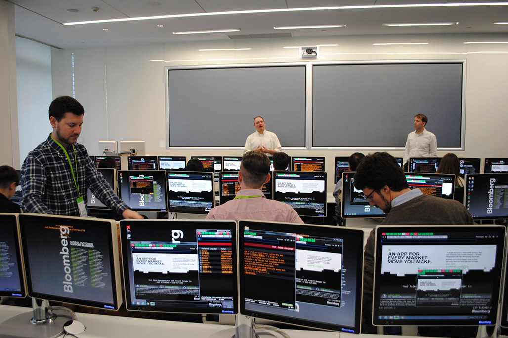 Academic talking to students in a computer lecturer