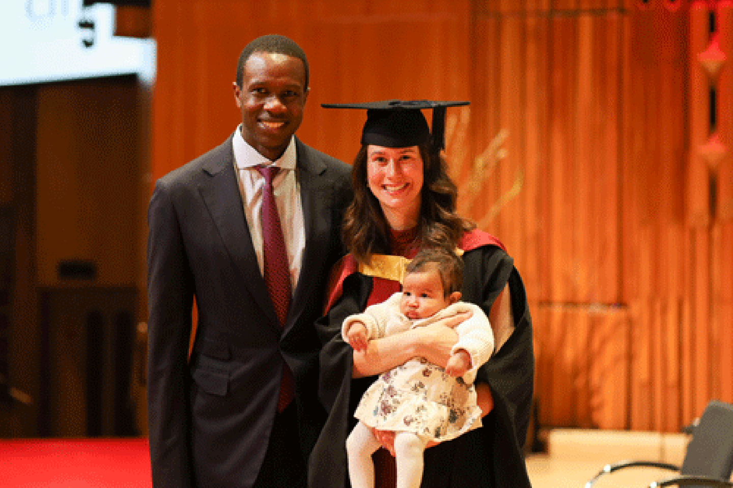 Student speaker, Rachel Preston with her husband Souleymane Ba and four-month old daughter Eleanor Ba