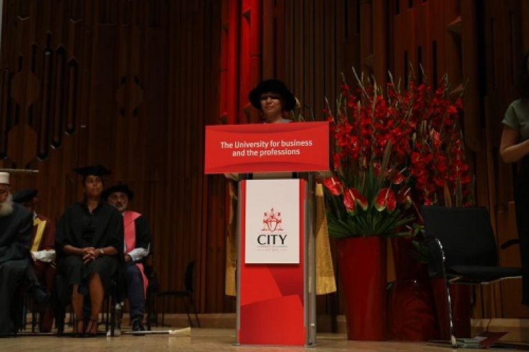 Dr Nighat Arif at the podium discussing her honorary doctorate award and advice to students