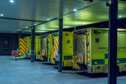 Ambulances line up outside of a hospital