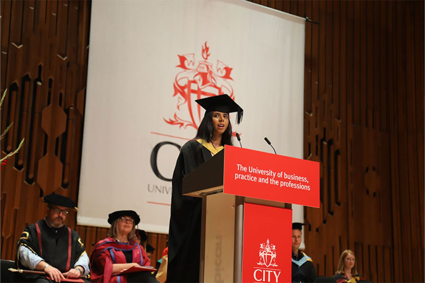 Student speaker Anjali Patel addresses fellow graduates at her graduation ceremony at the Barbican Centre