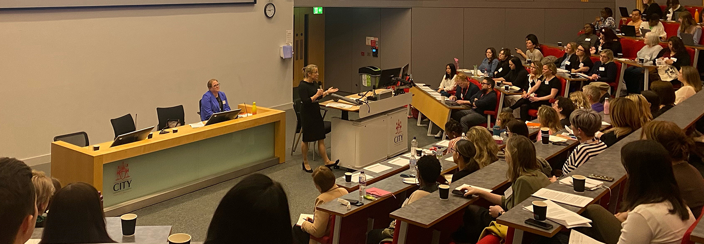 Katy-Barrow Grint, Thames Valley Police Assistant Chief Constable, speaks to conference attendees in a lecture theatre