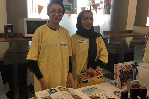 Two City Optometry students attending to one of the stands at the low vision day event at St Thomas' Hospital