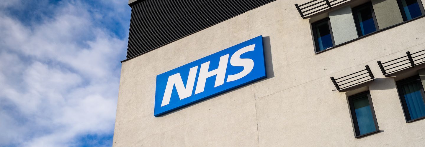 A view of the NHS logo outside a medical centre