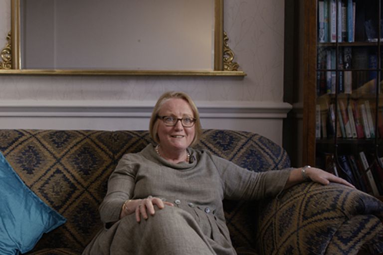 Professor Julienne Meyer sat on a sofa