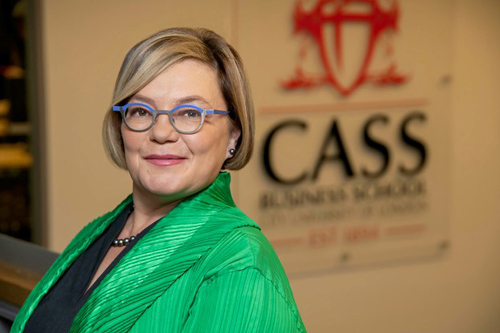 Professor Paula Jarzabkowski in front of Cass logo