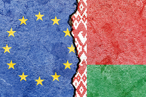 EU and Belarus flags separated by thick black border line