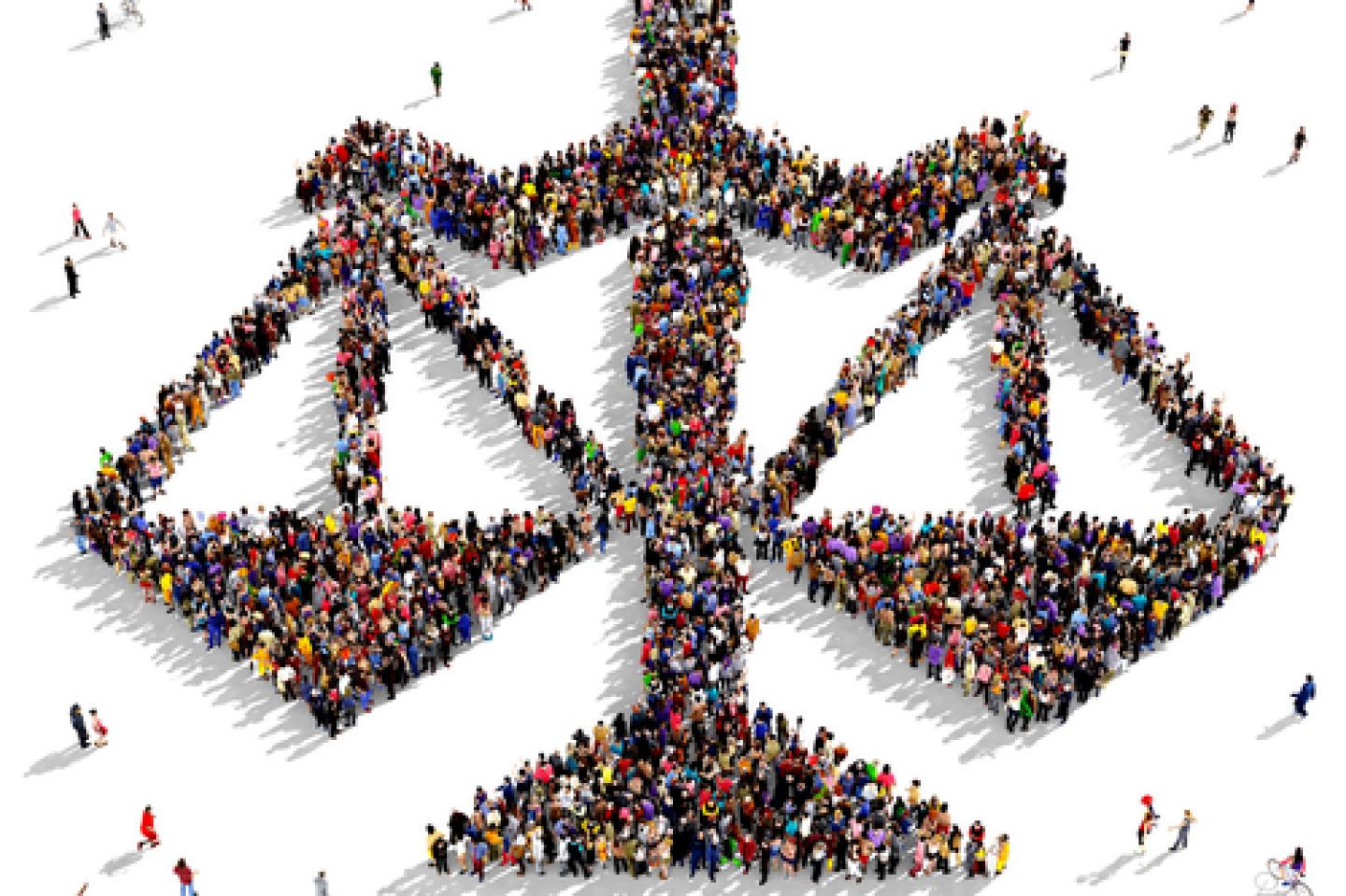 Large group of people seen from above gathered together in the shape of scales of justice icon
