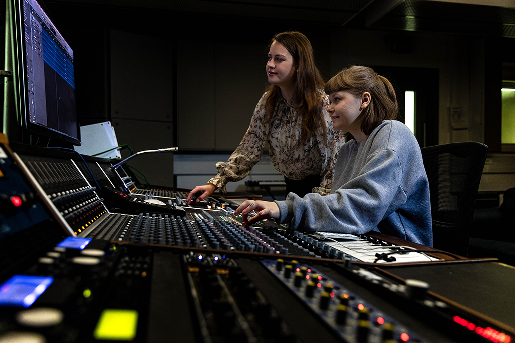 Two female students in music mixing studios
