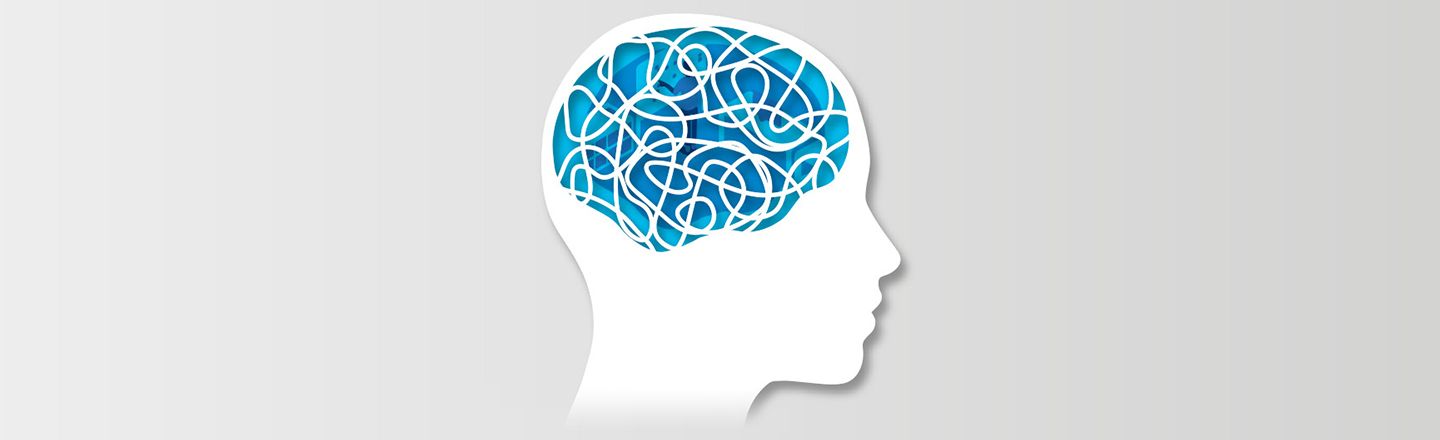 Illustration of head silhouette with workplace interior as brain