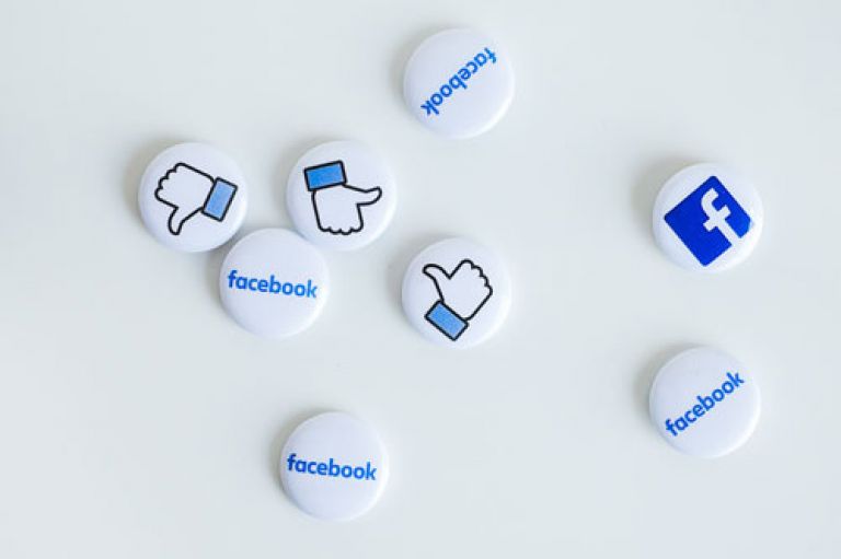Pin badges with Facebook logos and icons