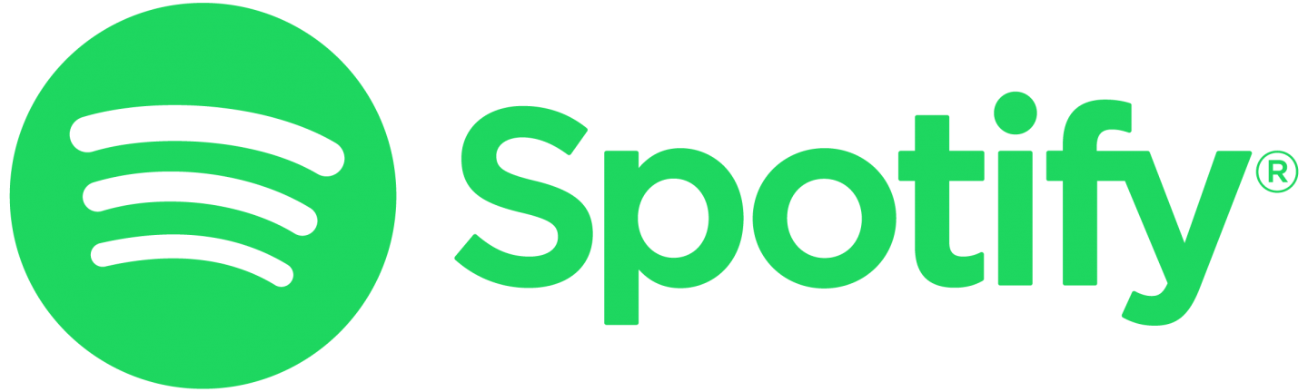 An image of Spotify's logo. The logo reads the word Spotify in green and to its left is a green circle with three curved parallel lines, which resembles the logo of sound going up.