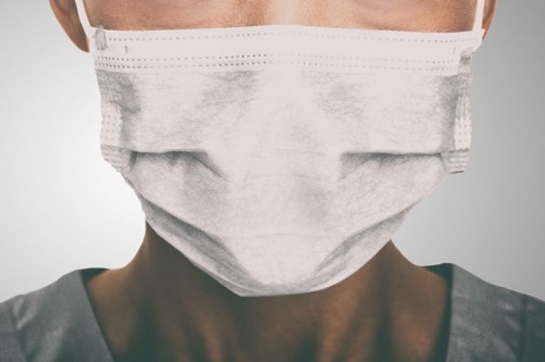 Face of a female nurse wearing a protective mask