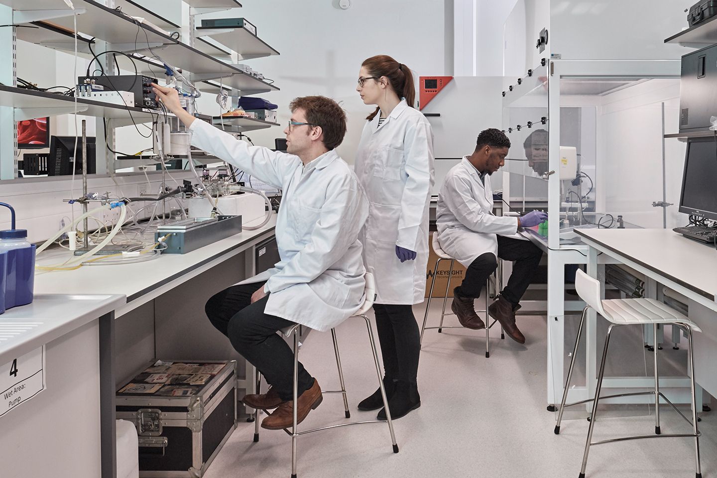 Three academics working in a laboratory