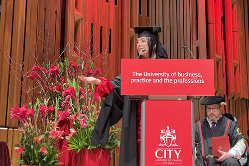 Arya Fatih, MA Broadcast Journalism (2022) addresses fellow graduates at the Barbican
