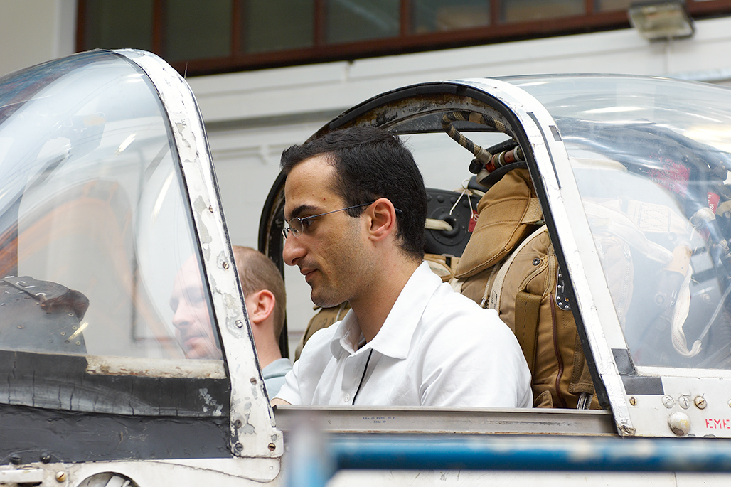 Male student inside aeroplane cockpit