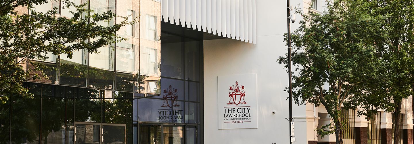 Exterior of City Law building focusing on 'The City Law School' outdoor logo sign