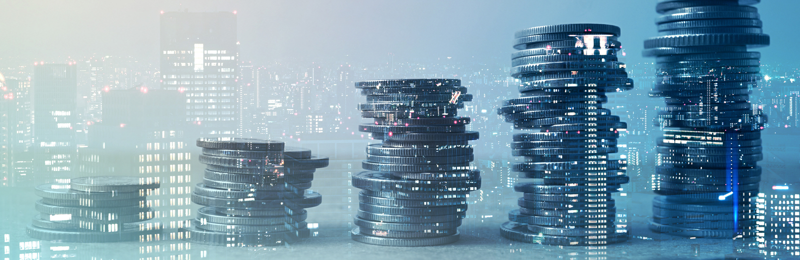 A pile of coins and the buildings in the background