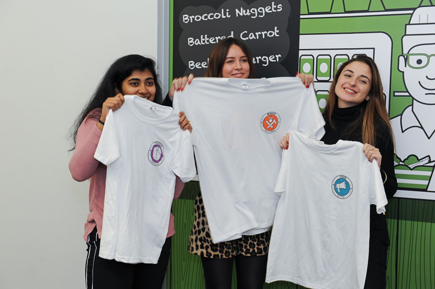City students holding City Starters t-shirts at City Starters Weekend