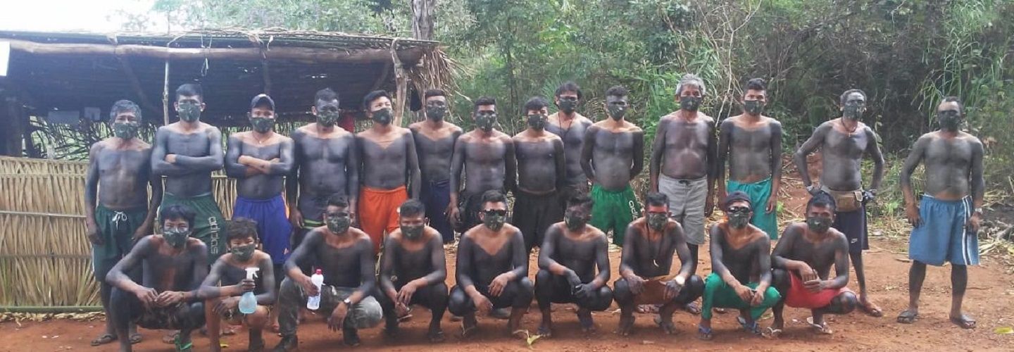 Indigenous Brazilian men with COVID-19 face masks on posing for a photo for PARI-c project