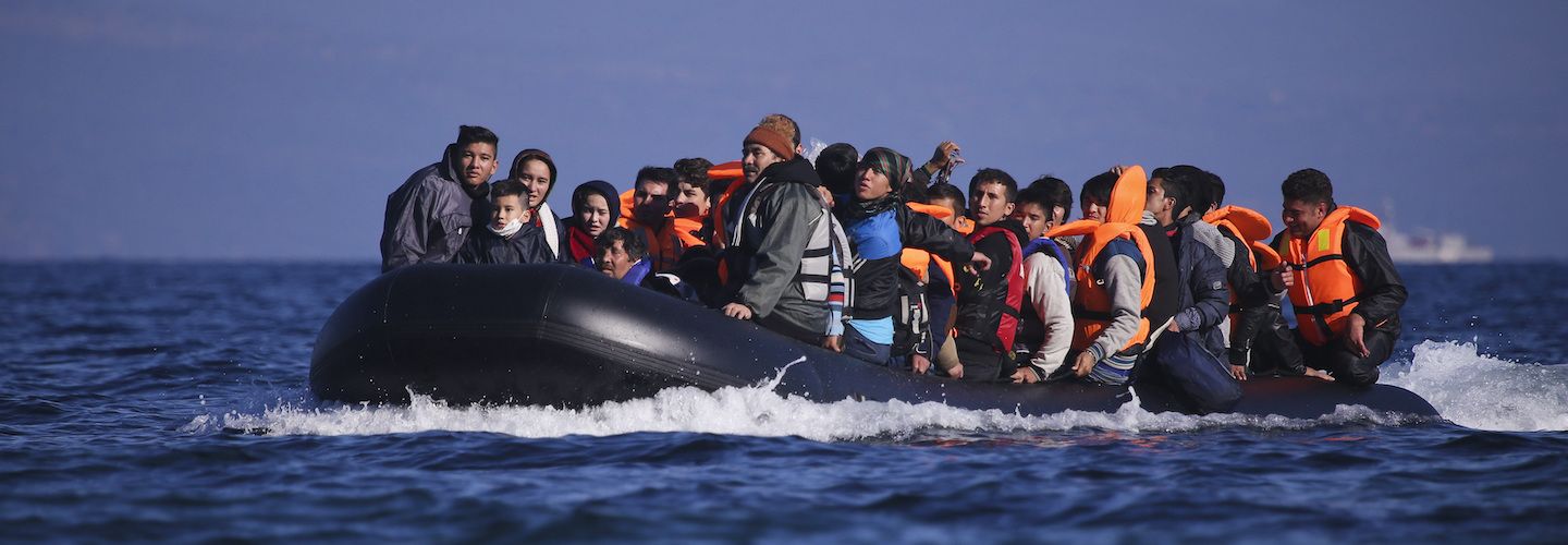 Groups of refugees and migrants aboard dinghies reach the Greek Island of Lesbos