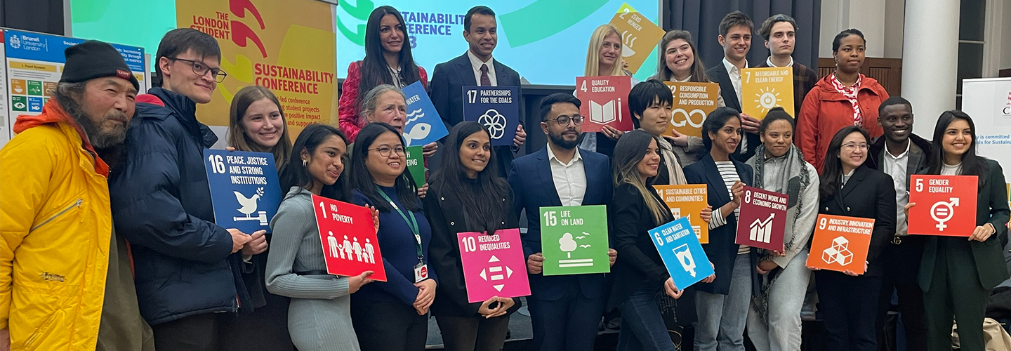 Students, staff and alumni hold posters of each of the UN Global Goals at the LSSC23