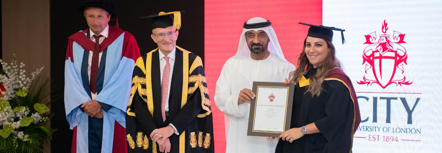 Mirna Sleiman is presented with her degree certificate 